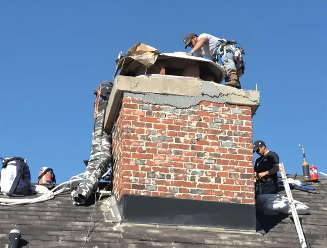 Davidson Chimney Sweep installing a custom chimney crown in Davidson, NC