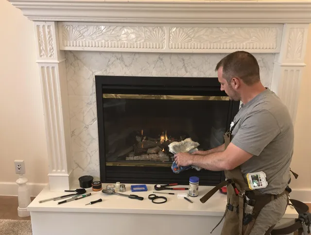 Davidson Chimney Sweep performing fireplace maintenance in Davidson, NC