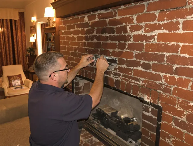 Davidson Chimney Sweep expert fixing a fireplace in Davidson, NC